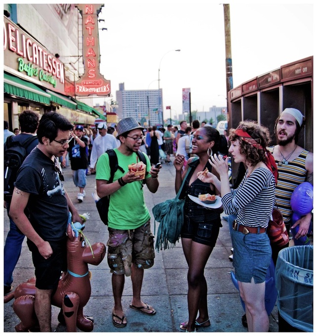 Picture of the New York City Mermaid Parade - Young People Socializing in Front of Nathan's Deli; part of www.FreePhotoCourse.com's NYC Exposed online photography exhibit; all rights reserved