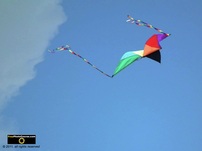 Cool picture of a colorful kite flying at the beach.© 2011, FreePhotoCourse.com, all rights reserved.  Awesome beach pictures & wallpapers. Download free jpg, jpeg photos.  