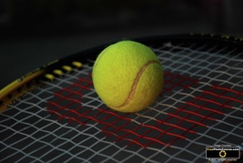Picture of a tennis ball and racquet.© 2011, FreePhotoCourse.com, all rights reserved.  Free high-res desktop wallpapers and pictures.  