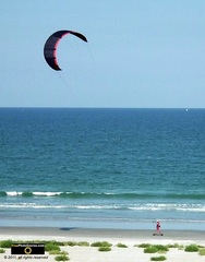 Picture of a kite surfer on the beach.© 2011, FreePhotoCourse.com, all rights reserved.  Awesome beach pictures & wallpapers. Download free jpg, jpeg photos.  