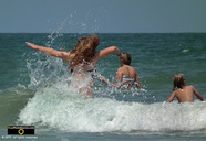 Fun picture of kids jumping in the waves at the beach.© 2011, FreePhotoCourse.com, all rights reserved.  Awesome beach pictures & wallpapers. Download free jpg, jpeg photos.  