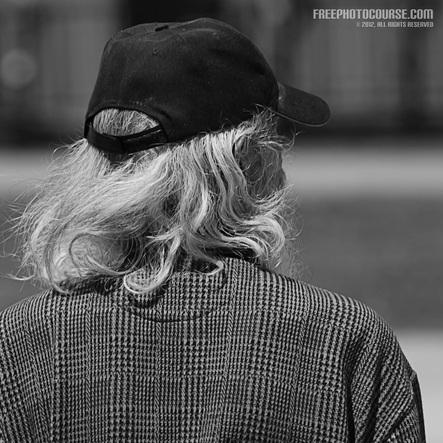 Street Photography - homeless man; part of tutorial on portraiture and use of short depth of field. (c) 2012, FreePhotoCourse.com, all rights reserved.