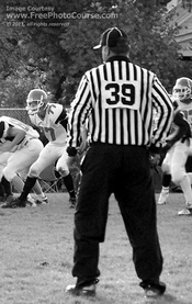 Picture of Referee at Football Game.  Free pictures downloadable at www.FreePhotoCourse.com. © 2011, FreePhotoCourse.com; all rights reserved. 