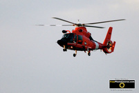 Picture of an orange US Coast Guard Helicopter.© 2011, FreePhotoCourse.com, all rights reserved.  Free high-res desktop wallpapers and pictures.   