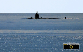 Picture of a US Naval Submarine surfacing on ocean.© 2011, FreePhotoCourse.com, all rights reserved.  Free high-res desktop wallpapers and pictures.  