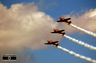 Picture of three Canadian Harvard Airplanes from WW2.  Tight formation air stunt team. ©2010, FreePhotoCourse.com  