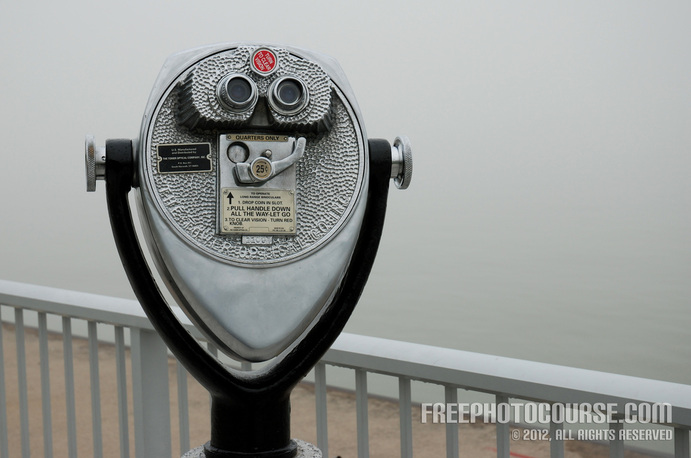 Picture of coin-operated binoculars on a waterfront vista.  Part of a tutorial on the Rule of Thirds in photographic composition. (c) 2012, FreePhotoCourse.com, all rights reserved.