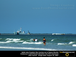 Picture of NASA Ship Freedom Star Towing Space Shuttle Endeavour's Solid Rocket Fuel Booster back to Cape Canaveral. ©2010, FreePhotoCourse.com  