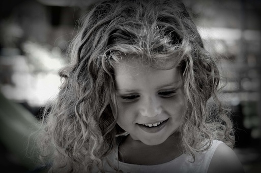 Picture of a young girl smiling. Featured in FreePhotoCourse.com's Monthly Contributor's Photo Gallery. © 2012, Carmel Lalo.  