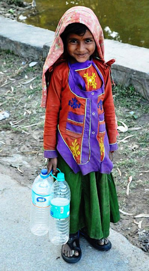 Picture of an adorable Indian girl from a small village.  Photo by Ather Qureshi, as featured on FreePhotoCourse.com. © 2012, all rights reserved. 