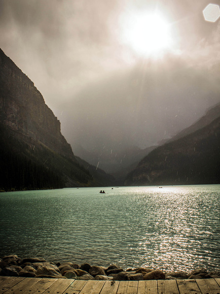 Picture of beautiful rain and sun over Lake Louise, Alberta, Canada.  Selected to be featured in the September, 2012 Contributor's Gallery at FreePhotoCourse.com.  Photo by Leah McInnis, © 2012, all rights reserved 
