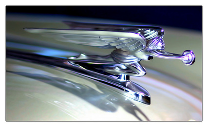 Artitistic picture of a hood ornament.  Featured in the September 2011 Contributor's Photo Gallery at FreePhotoCourse.com.  © 2012, Greg Lueck, all rights reserved