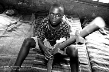 Picture of a former child soldier in the Congo.  © 2006, Matthieu Alexandre; part of FreePhotoCourse.com's “Photographer Profiles” series; DO NOT COPY – IP Address recorded - all rights reserved.  
